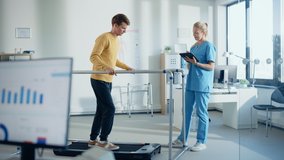 Hospital Physical Therapy Room: Patient with Injury Walking on Treadmill Holding for Parallel Bars, Professional Physiotherapist Assists, Helps, Trains Disabled Person Do Rehabilitative Physiotherapy - Powered by Shutterstock - Get 15% off with code: PIKWIZARD15