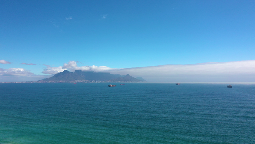 Gyperlapse. Clouds over table top mountain at sunset and the city of Cape Town,South Africa.