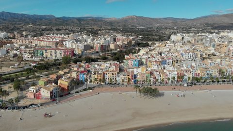 Aerial drone point panoramic view coastline and La Vila Joiosa Villajoyosa touristic resort townscape view from top, sandy beach and mediterranean seascape. Province of Alicante, Costa Blanca, Spain