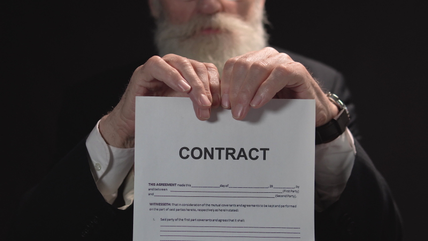 Serious bearded businessman tearing paper with contract sign, bad conditions Royalty-Free Stock Footage #1066427557