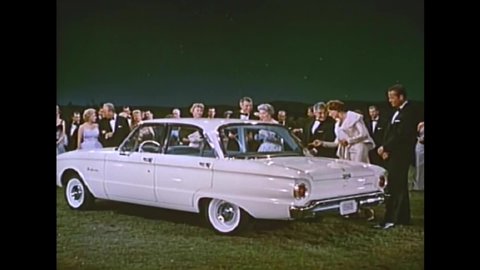 CIRCA 1960s - Three new models of Fords are shown to party guests, backed by a choir in 1960.