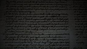 The light of a lamp illuminates an ancient manuscript of 1700 century written in ink and goose pen in Italian. Antique letter with handwritten text. Stained texture background. Vintage style toned pic - Powered by Shutterstock - Get 15% off with code: PIKWIZARD15