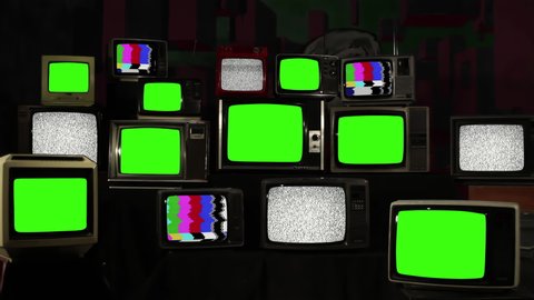 Pile of Vintage TVs with Green Screens among Others with Color Bars and Static Noise. 4K Resolution.