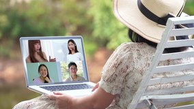 Asian businesswoman working from home having Online business videoconference on laptop, New normal concept.