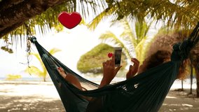 Woman with Smartphone Collect Likes Relaxing in a Hammock. Flying animation 3D heart symbols. Social Media Concept. - Powered by Shutterstock - Get 15% off with code: PIKWIZARD15
