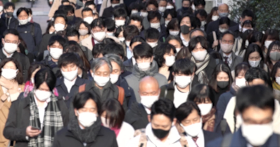 Covid-19 : Crowd of people wearing masks walking to work in Tokyo, JAPAN | Shutterstock HD Video #1066463830