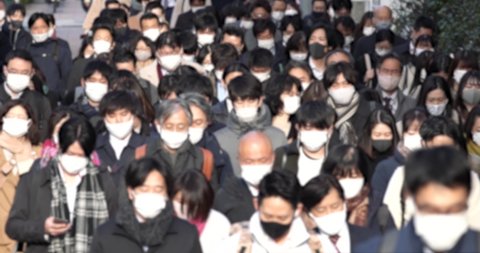 Covid-19 : Crowd of people wearing masks walking to work in Tokyo, JAPAN