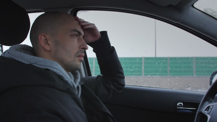 A man falls asleep from fatigue driving a car on the highway in winter. Royalty-Free Stock Footage #1066465210