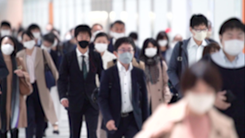 Covid-19 : Crowd of people wearing masks walking to work | Shutterstock HD Video #1066465375