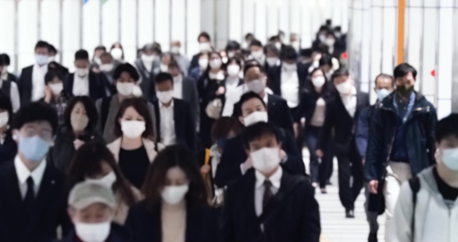 Covid-19 : Crowd of people wearing masks walking to work | Shutterstock HD Video #1066465390