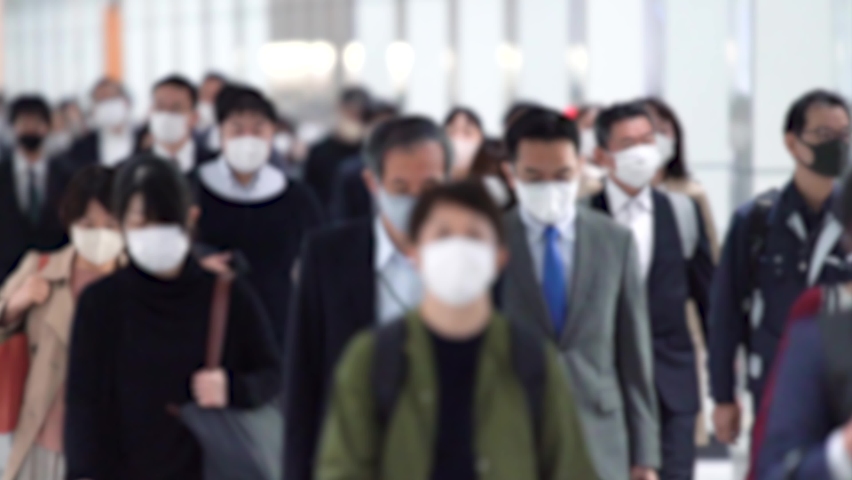Covid-19 : Crowd of people wearing masks walking to work | Shutterstock HD Video #1066465399