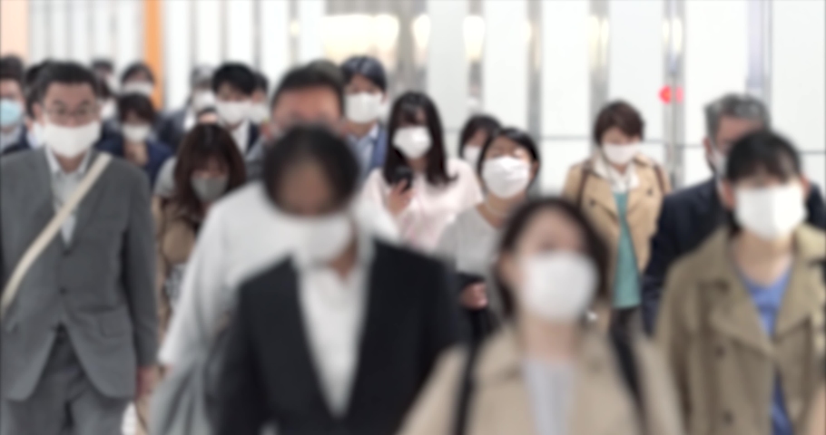 Covid-19 : Crowd of people wearing masks walking to work | Shutterstock HD Video #1066465417