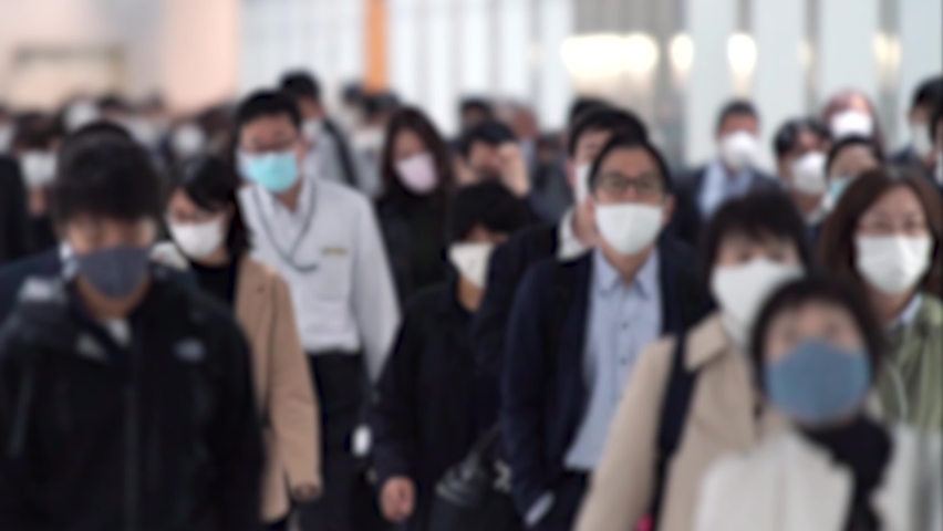 Covid-19 : Crowd of people wearing masks walking to work | Shutterstock HD Video #1066465429
