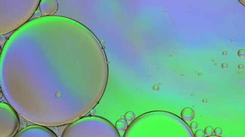 Color artistic of oil drop floating on the water. Pastel color bubble for background. 