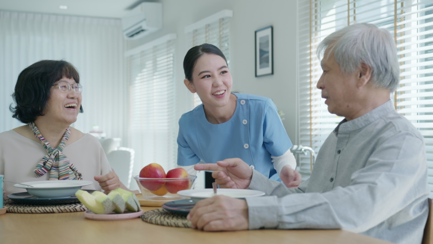 Attractive young senior asian citizen couple happy sit, talk, eat soup for healthy nutrition breakfast meal on dining table at home in morning in routine lifestyle in old asia nursing in-home care. Royalty-Free Stock Footage #1066489687