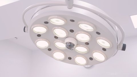 Surgical lamp in the operating room. Close-up. The surgical light turns on and off