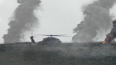 Army Helicopter Blackhawk in war battlefield takes off
, smoke rising in background, Idf Israel defence force Blackhawk in action
