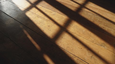 timelapse of sunshine through windows with shadows on wooden floor old