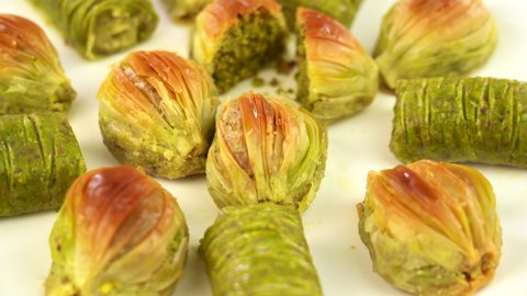 Turkish Midye Baklava  ( Mussel Shape Baklava ) with green pistachio nuts and Sarma ( Green pistachio wrap) 
