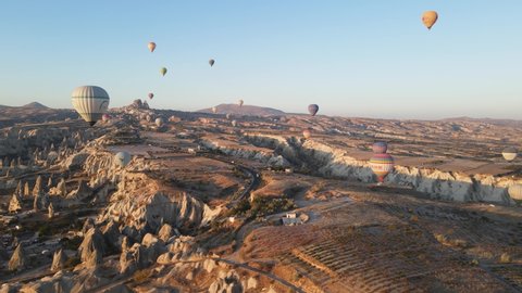 GOREME, TURKEY - NOVEMBER 17, 2020. Aerial view of Cappadocia, Turkey : Balloons in the sky. Slow motion