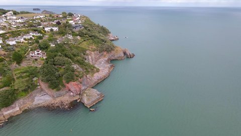 Coastal Town of Torquay, England - Aerial View Above Rocky Sea Cliffs