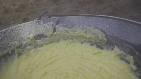 Cauldron With Cooked Polenta. Boiled Cornmeal, zoom out