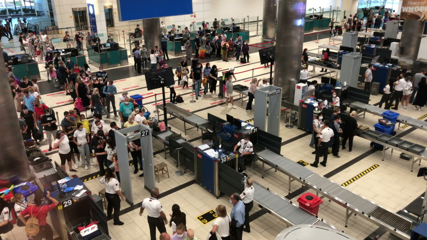 Antalya, Turkey-circa Oct, 2020: Lines for pax baggage security check service in departure terminal of the Fraport TAV Antalya Airport. People boarding at gate