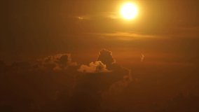 The sunset with sun shining on the moving clouds  -  time-lapse video