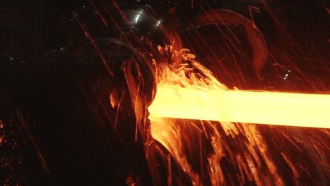 red hot metal bars in continuous casting machine at metallurgical plant 