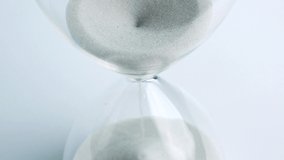 Sand pouring in hourglass, Time concept. - Powered by Shutterstock - Get 15% off with code: PIKWIZARD15