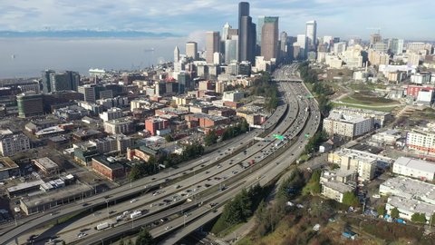 Cinematic aerial drone dolly footage of First Hill, Yesler Terrace, Atlantic, Cherry Hill, Squire Park, skyscrapers and high-rise commercial and residential buildings downtown Seattle, Washington