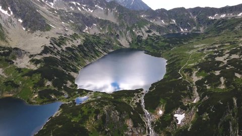 Aerial 4K drone footage of Tatra Mountains in Zakopane with lakes and waterfalls on top of the mountains