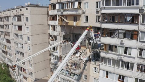 Background of damaged living home construction and rescue operation after gas bomb explosion.
