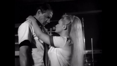 CIRCA 1969 - In this sexploitation movie, a mad scientist vows to use the body of his sexy assistant any way he wants.