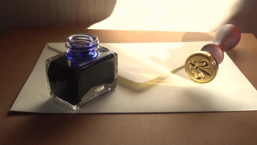 Signing a letter in the medieval traditional way. Concept of invitation in the past. The 18th-century technique of mailing. Authentic medieval way to send encrypted secured messages.