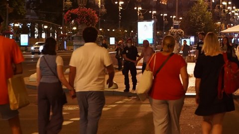 Kyiv, Ukraine - Summer, 2020. Patrol police detained a drunk man on the central street of the capital, the criminal is being taken to the police station.