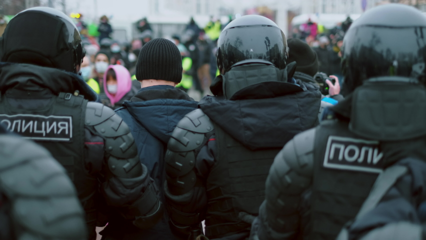 Police arresting people political strike riot protest. Special forces detainment offender convict. Stop. SWAT officers cops arrested rebel. Policemen detained protester. Human right. handcuffed hand. Royalty-Free Stock Footage #1066601758