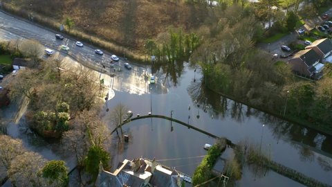 Mid high hooton cross roads flood. Main road in UK flooded during storm christoph. Local pub also flooded in same shot.