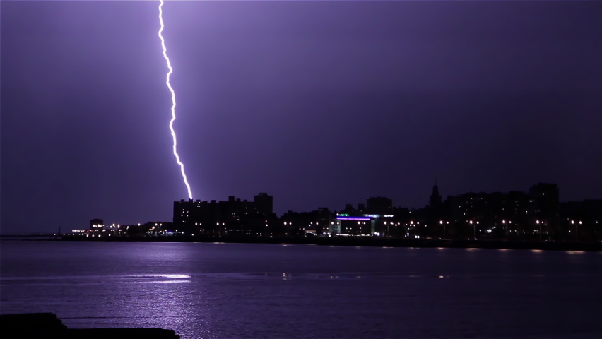 Thunderstorm over the City, a Lightning Flashes during a Thunderstorm over Montevideo City, Uruguay. 4K Resolution. Royalty-Free Stock Footage #1066604686