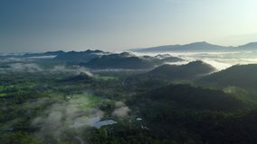 Hyper lapse 4k video, flying through the clouds above the mountain peak. Beautiful morning natural scenery.