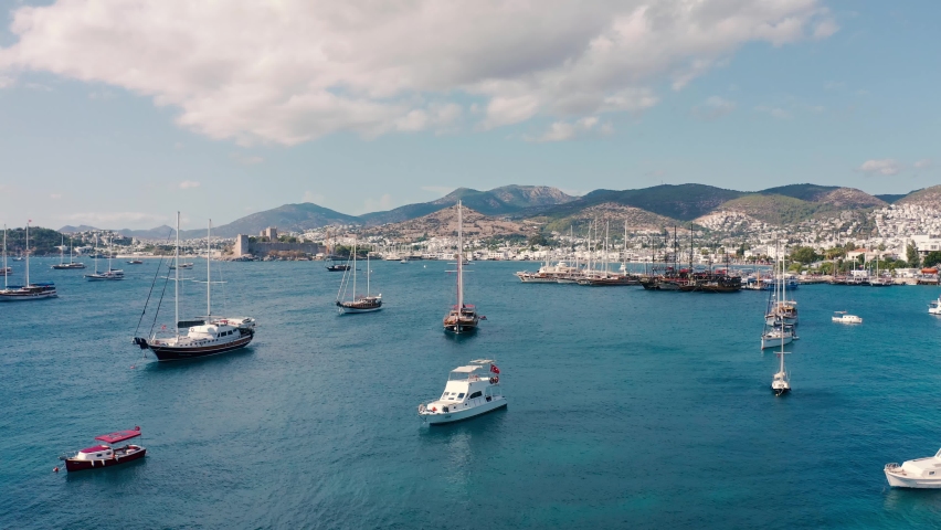 Amazing drone shots sailing boats and yatchs at sunny summer day in Bodrum, Turkey. Aerual view 4K. Royalty-Free Stock Footage #1066619629