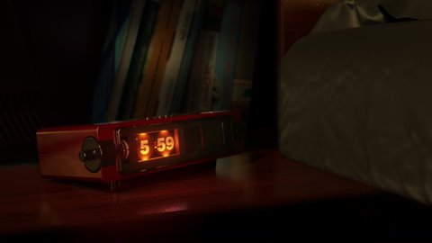 Vintage alarm clock with flip dial and radio wake up at 6 AM. Close-up view. The numbers on the clock screen changes from 5:59 to 6:00 AM. Then turns on the radio receiver and its scale lights up