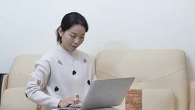 Asian women work from home, play on their phones.Asian women.