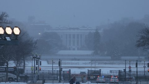 Washington, DC - United States - February 1 2021: The south lawn of the White House and the Ellipse seen during a winter snowstorm.