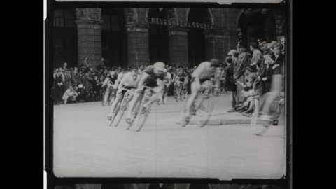 1949 Paris, France. Cyclist turn a Corner and crash their Bikes during the Champs-Élysées stage in the Tour de France. 4K Overscan of Vinatge Archival 16mm Film Print. 