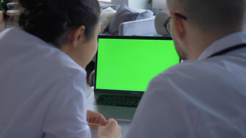 Two Scientists Use Computer with Green Chroma Key Screen, Specialists Discuss Innovative Technology. Advanced Scientific Lab for Medicine, Biotechnology Royalty-Free Stock Footage #1066636927