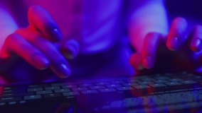 Use of tablet pc in shining neon light. Creative vivid color of ultraviolet red and blue. Hands of person typing article text or document on mobile computer closeup in trendy neon room at dark night - Powered by Shutterstock - Get 15% off with code: PIKWIZARD15