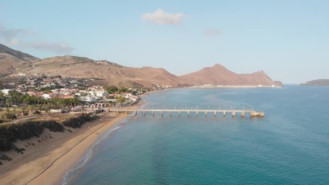 Aerial of the Porto Santo beach with a bridge leading out into the water.
