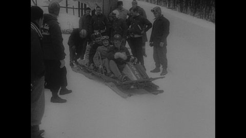 1940s: People on bobsled approach course. People ride bobsled down course.
