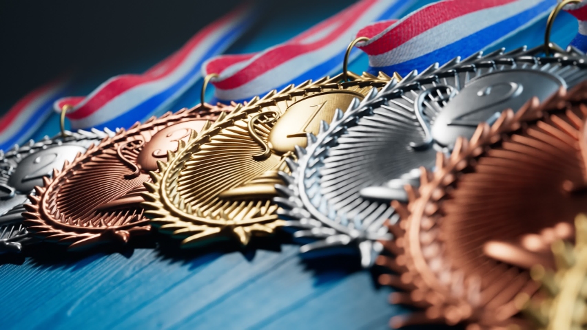 Endless animation of gold, silver and brown medals for winners. Prizes for champions. Shiny sports awards with ribbons. Symbol of winning competition, success, victory, triumph, achievement. Trophies.